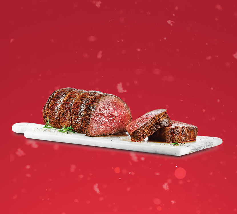 Sterling Silver beef tenderloin roast on a red background