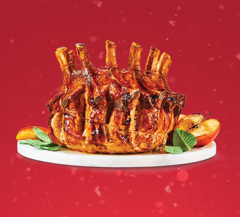 Pork crown roast on red background