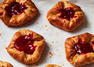 Fruit Danish on baking sheet filled with raspberry